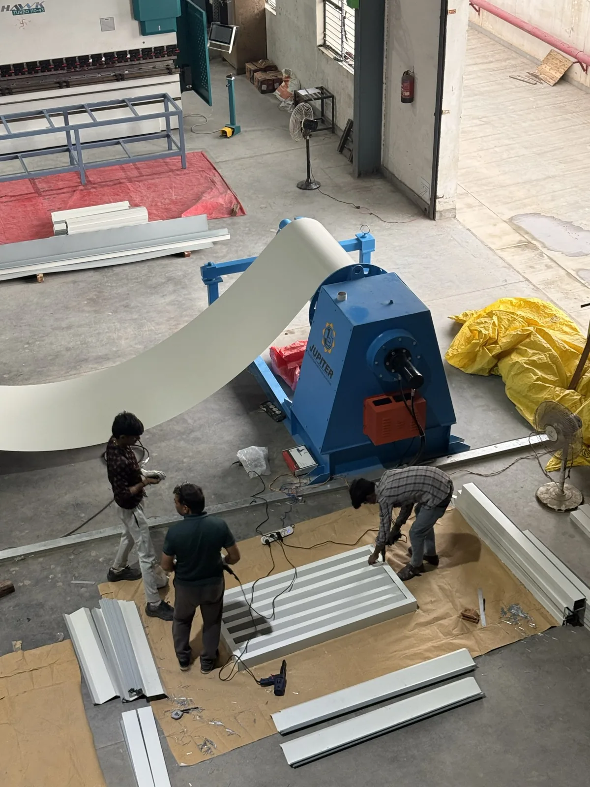 JUPITER decoiler feeding steel coil into production
